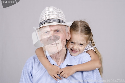 Image of Portrait of an old man eighty years with granddaughter