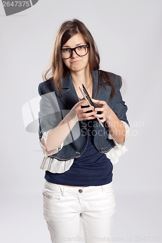 Image of Young long-haired woman and tablet