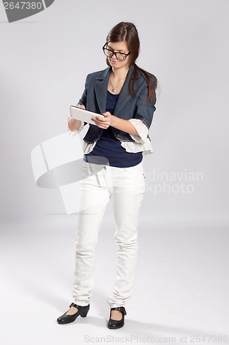 Image of Young long-haired woman and tablet