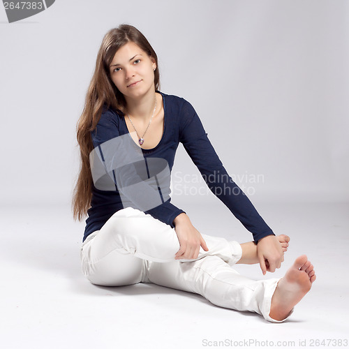 Image of Young long-haired woman with natural beauty