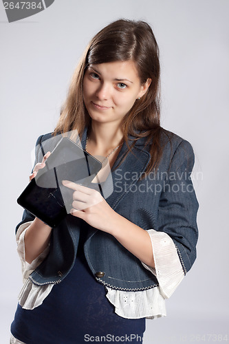 Image of Young long-haired woman and tablet