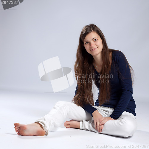 Image of Young long-haired woman with natural beauty