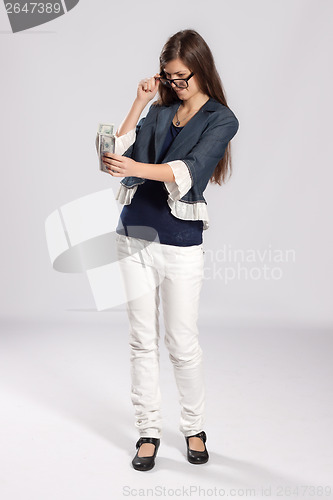 Image of Young long-haired woman and money