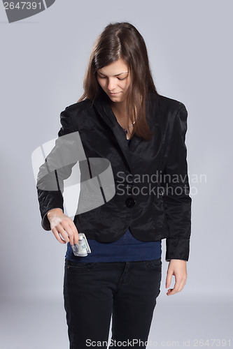 Image of Young long-haired woman and money