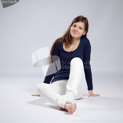 Image of Young long-haired woman with natural beauty