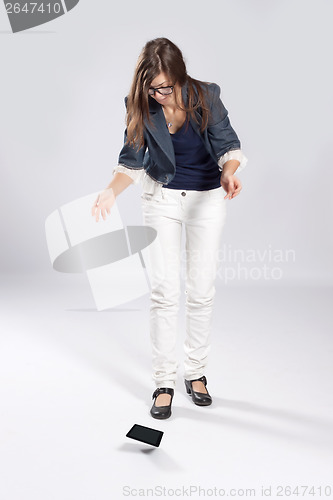 Image of Young long-haired woman and tablet