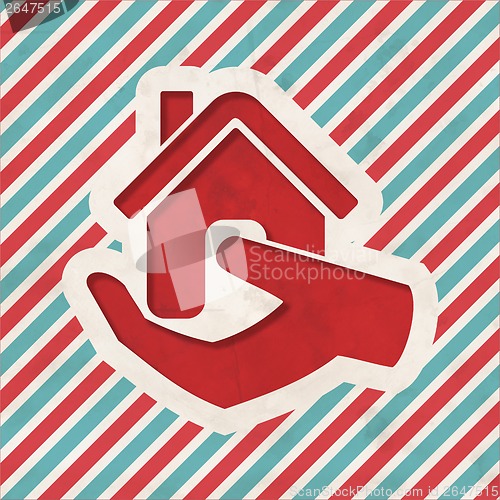 Image of Home in Hand Icon on Striped Background.