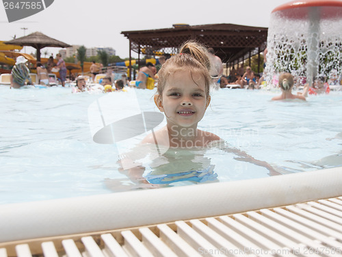 Image of Four-year-old girl bathing in the pool