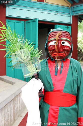 Image of Person in traditional South Korean costume and mask