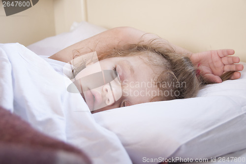 Image of Two-year-old girl sleeping in the train