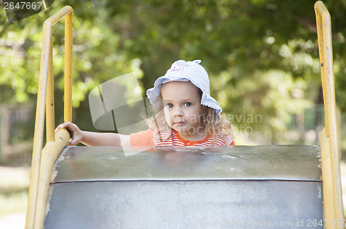 Image of little girl up stairs at children of old metal hill