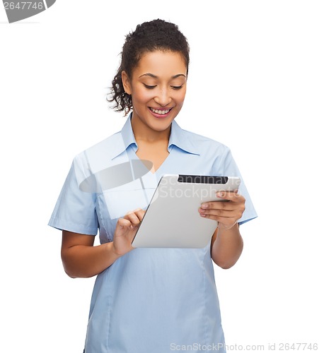 Image of smiling black doctor or nurse with tablet pc