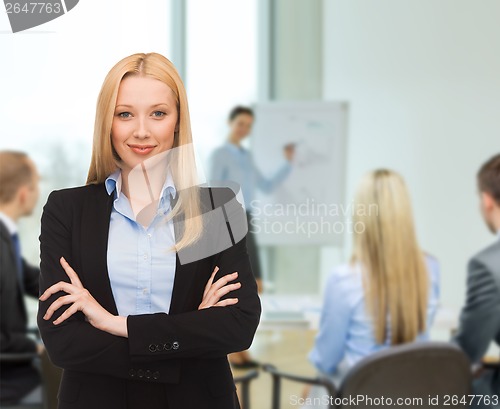 Image of smiling businesswoman at office