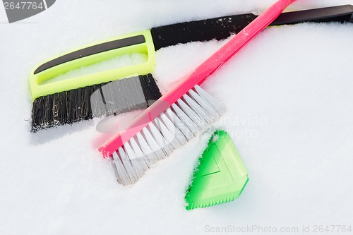 Image of variety of snow cleaning equipment on snow