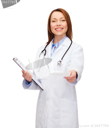 Image of smiling female doctor with clipboard