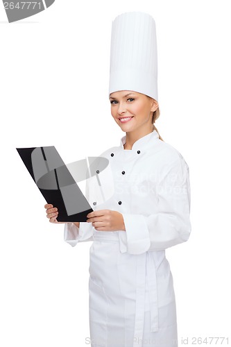 Image of smiling female chef with black blank paper