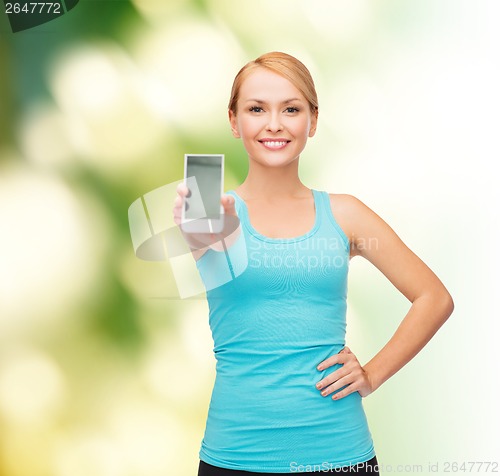 Image of sporty woman with smartphone