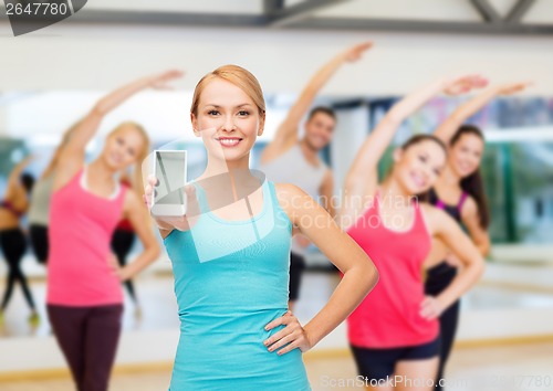 Image of sporty woman with smartphone