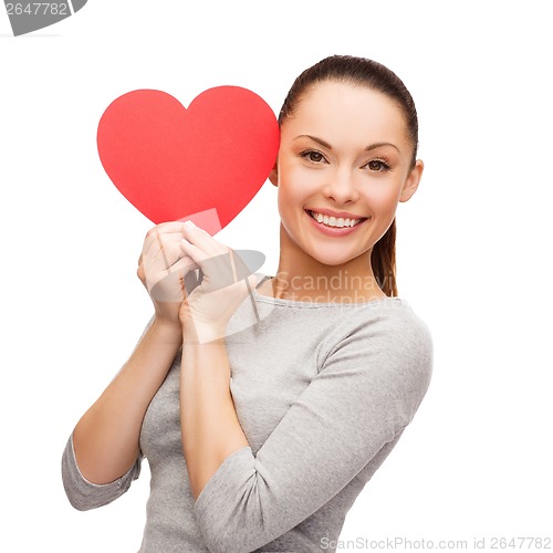 Image of smiling asian woman with red heart