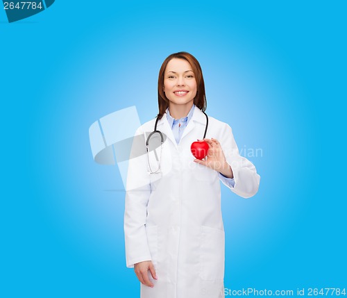 Image of smiling female doctor with heart and stethoscope