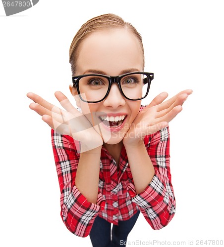 Image of smiling teenager in eyeglasses screaming