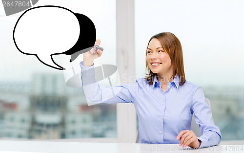 Image of businesswoman drawing text bubble