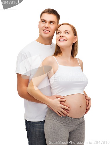 Image of happy young family expecting child