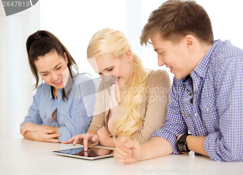 Image of smiling students with tablet pc computer at school
