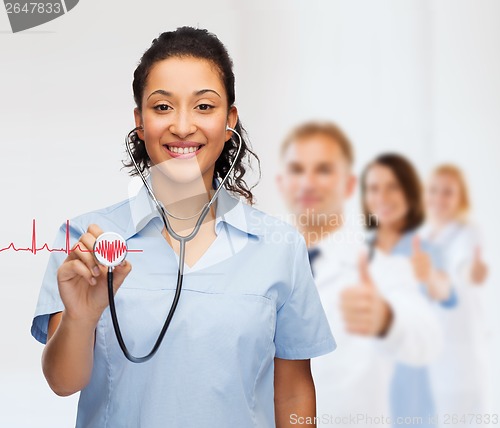 Image of smiling female african american doctor or nurse