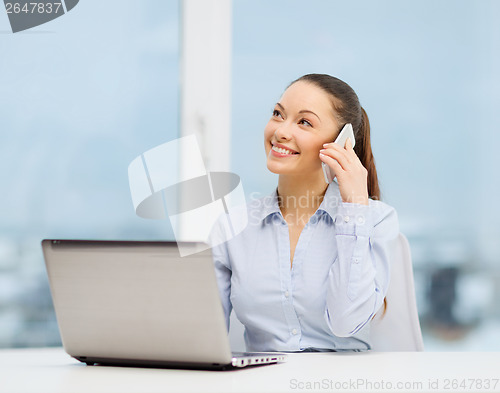 Image of smiling businesswoman with laptop