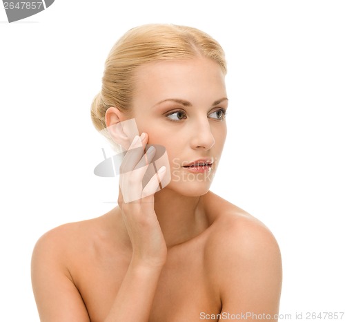 Image of beautiful woman touching her face skin