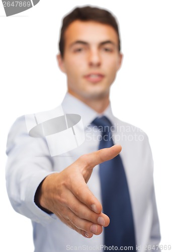 Image of buisnessman with open hand ready for handshake