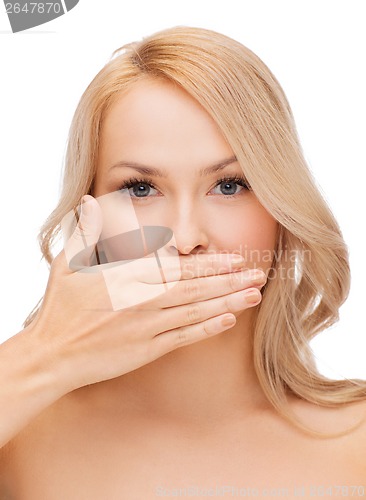 Image of beautiful woman covering her mouth