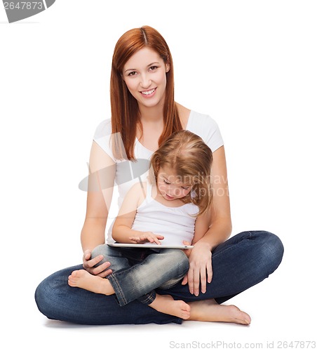 Image of happy mother with little girl and tablet pc