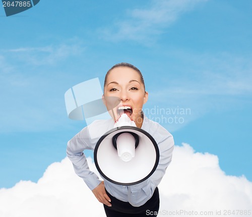 Image of screaming businesswoman with megaphone