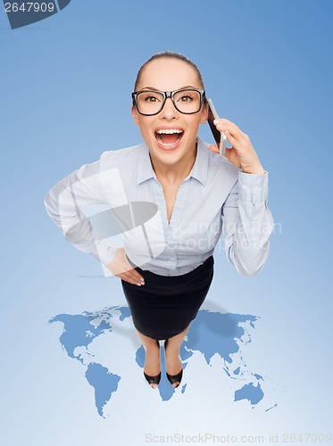 Image of happy businesswoman in eyeglasses with smartphone