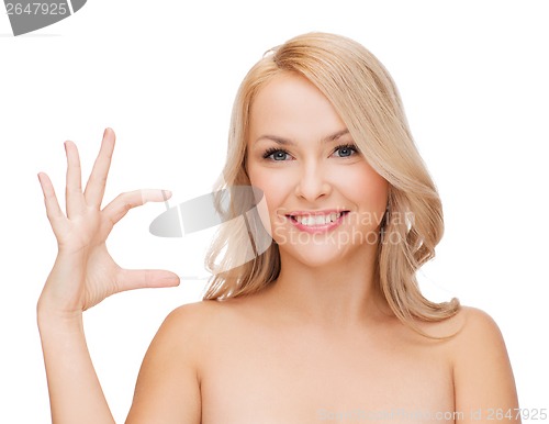 Image of smiling woman holding something imaginary