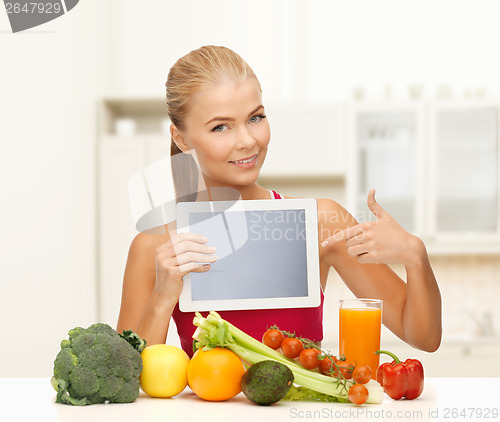 Image of woman with fruits, vegetables and tablet pc
