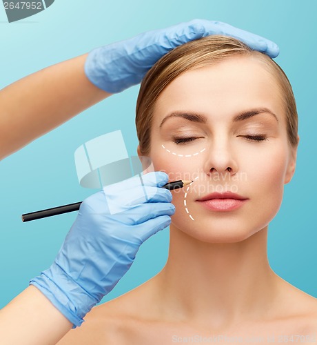 Image of woman face and beautician hands with pencil