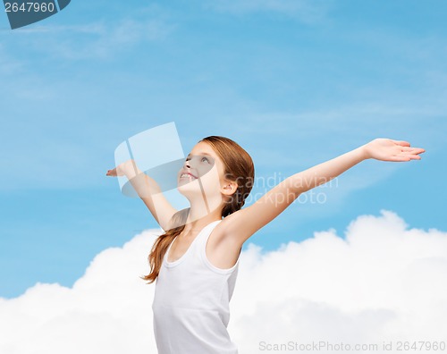 Image of smiling teenage girl with raised hands