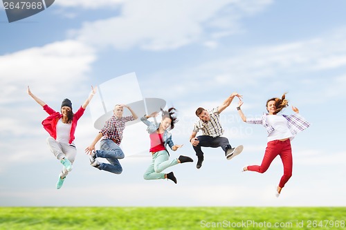 Image of group of teenagers jumping