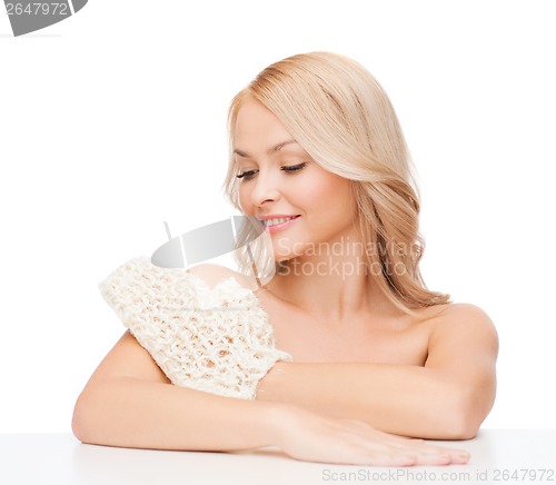 Image of smiling woman with exfoliation glove