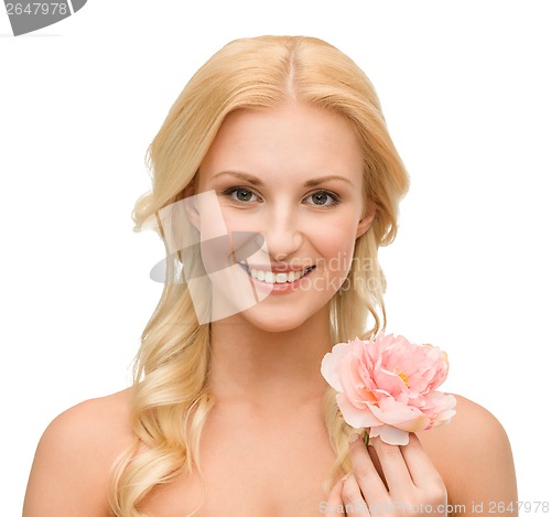 Image of smiling woman with peony flower