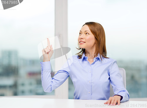 Image of attractive businesswoman at office