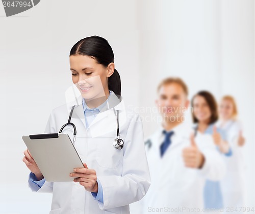 Image of female doctor with stethoscope and tablet pc