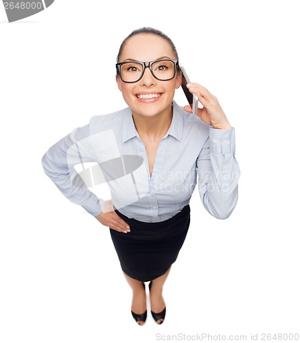 Image of happy businesswoman in eyeglasses with smartphone