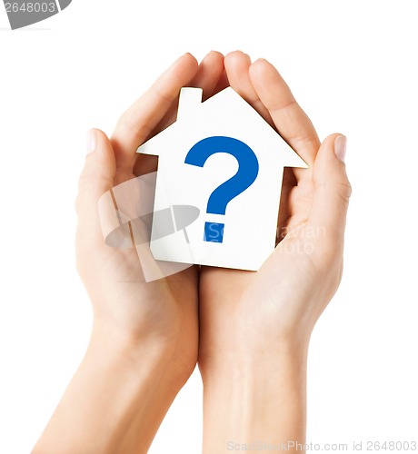 Image of hands holding house with question mark