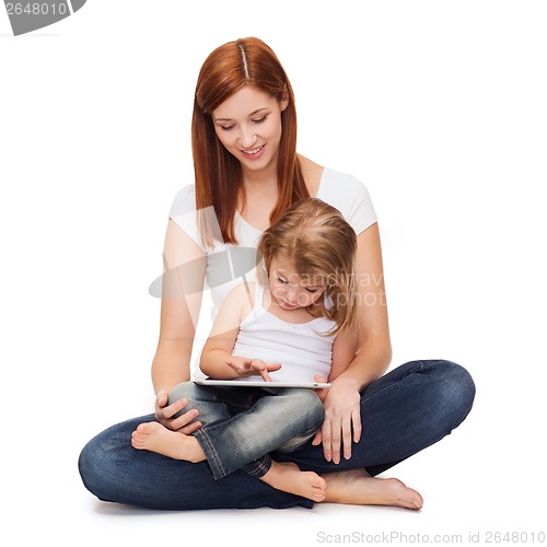 Image of happy mother with little girl and tablet pc