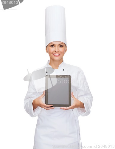 Image of smiling female chef with tablet pc blank screen