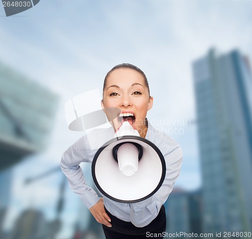 Image of screaming businesswoman with megaphone